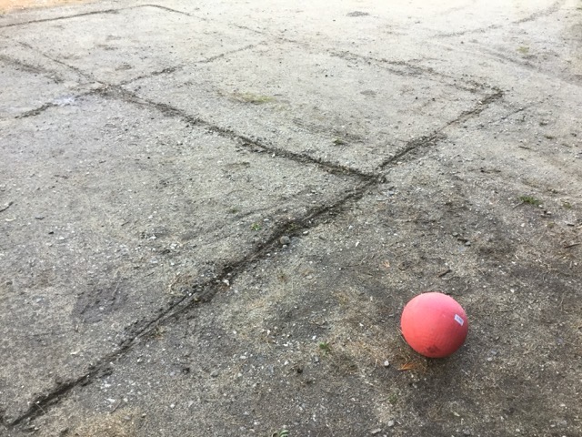 A makeshift four-square court scratched into our dirt driveway. (2016)