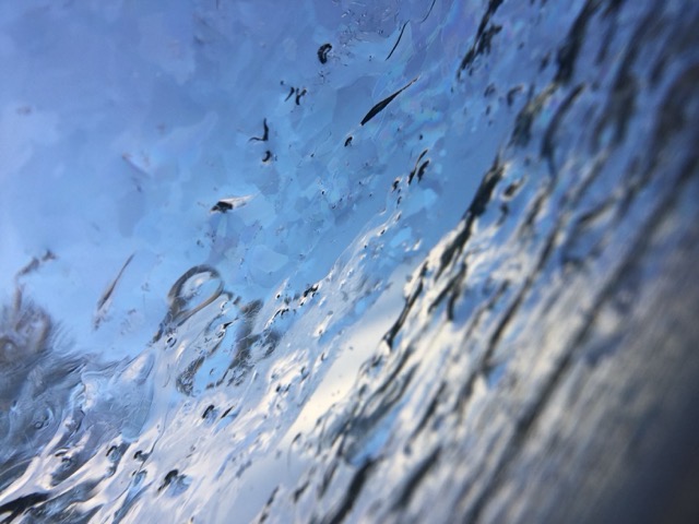 Irregular buildup of ice on a skylight window. (2016)