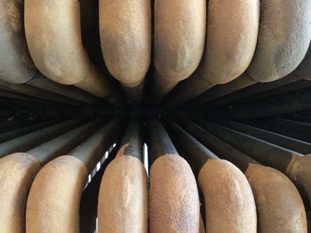 Pipes for a machine of some sort (perhaps a steam engine) at the Mystic Seaport, CT. (2017)