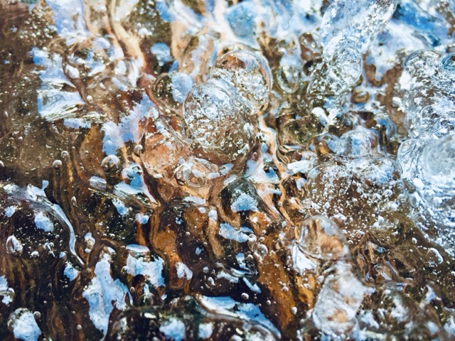 A strange formation of ice over a wooden surface. (2019)