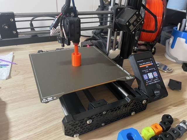 Printing a replacement button for the fragile spring-loaded latch on a vehicle snow brush. (2025)