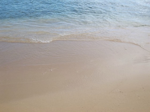 Water laps on the soft sand of Waikiki Beach in Honolulu. (2014)