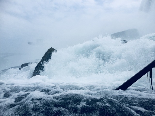 Water crashes over the base of the American side of Niagara Falls, NY. (2016, color graded)